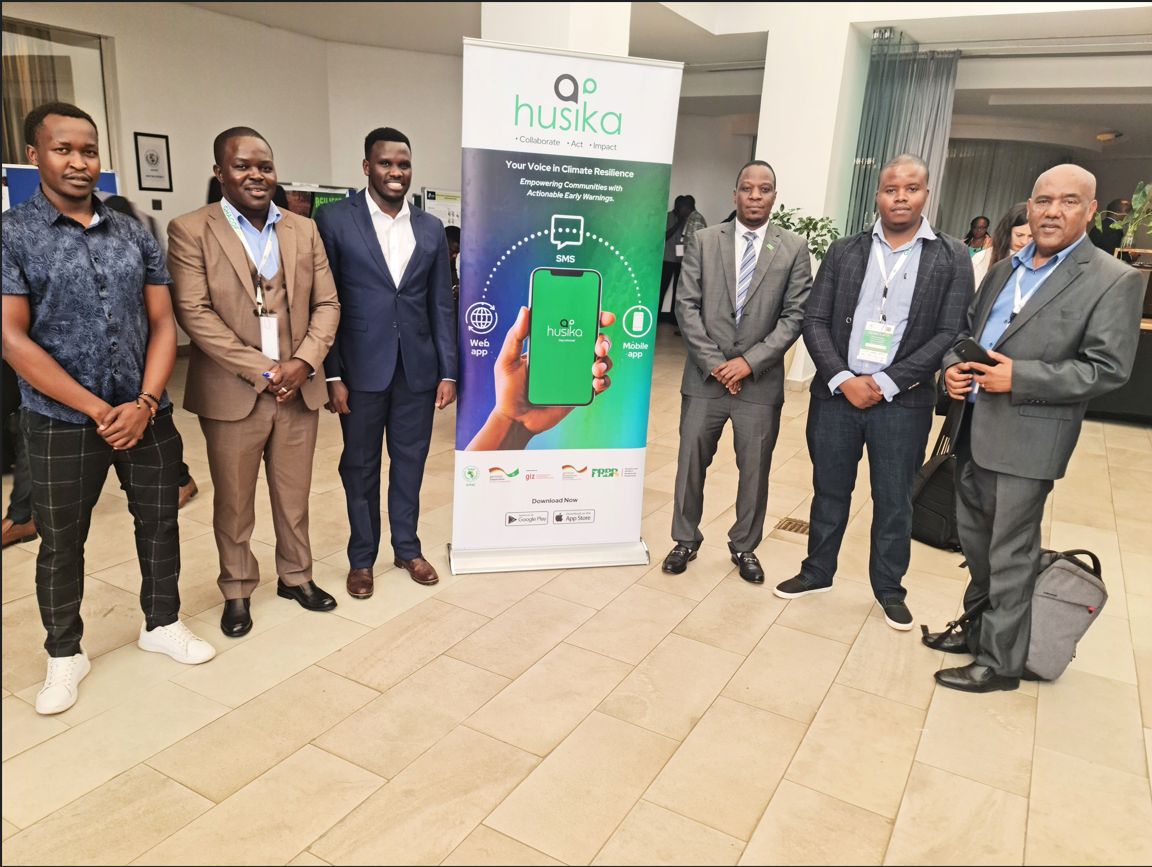 A photo of Wilberforce Seguton and other partners during the launch of the Husika App