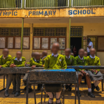 Learners at Olympic Primary School sit on desks made by plastic waste