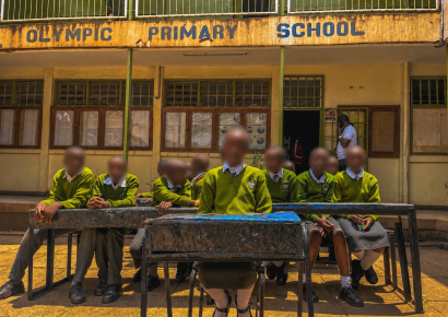 Learners at Olympic Primary School sit on desks made by plastic waste