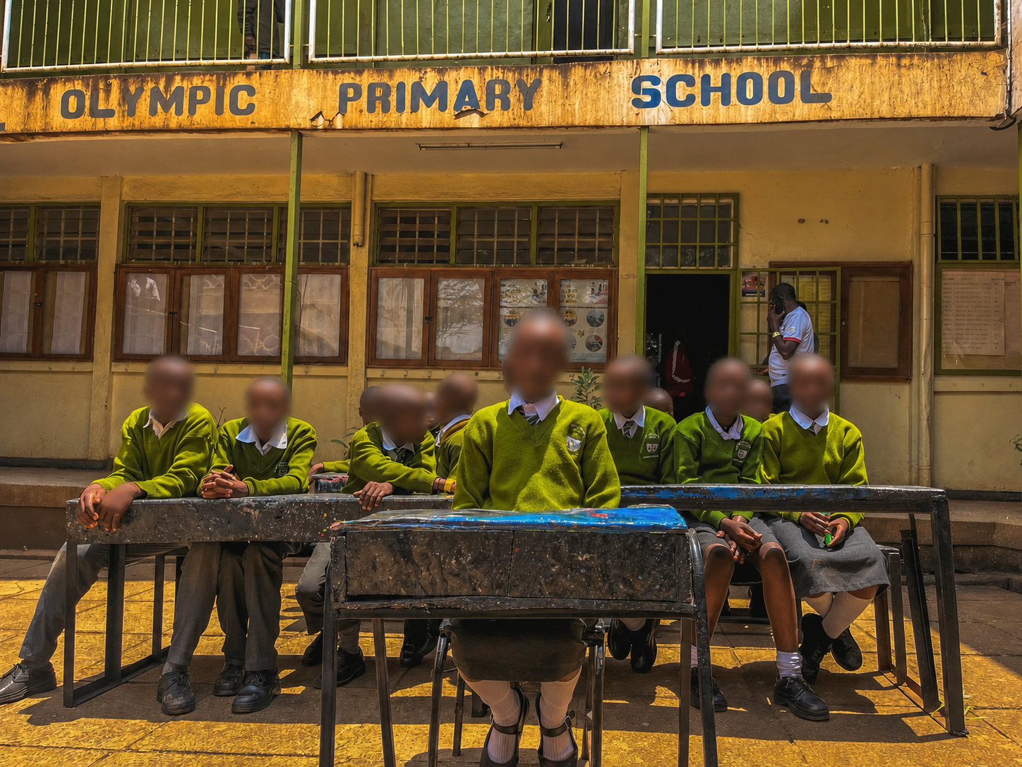 Learners at Olympic Primary School sit on desks made by plastic waste